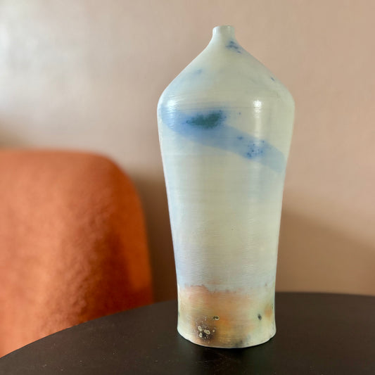 A saggar fired porcelain vase in light shades of blue and brown. Made by ceramic artist Hillit Wahlberg