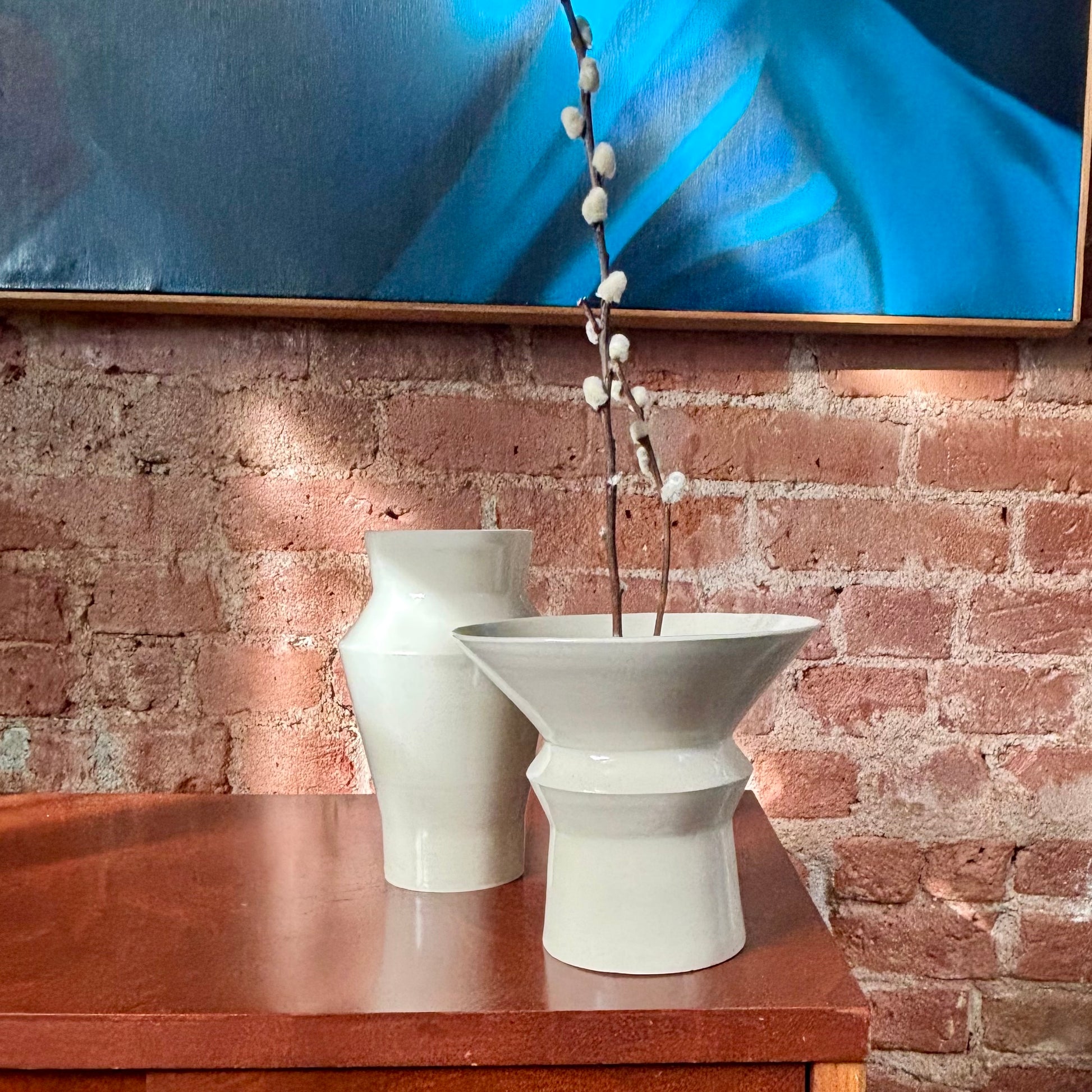 A porcelain angular vase with a wide opening at the top. Perfect for ikebana or as is. Made by Hillit Wahlberg