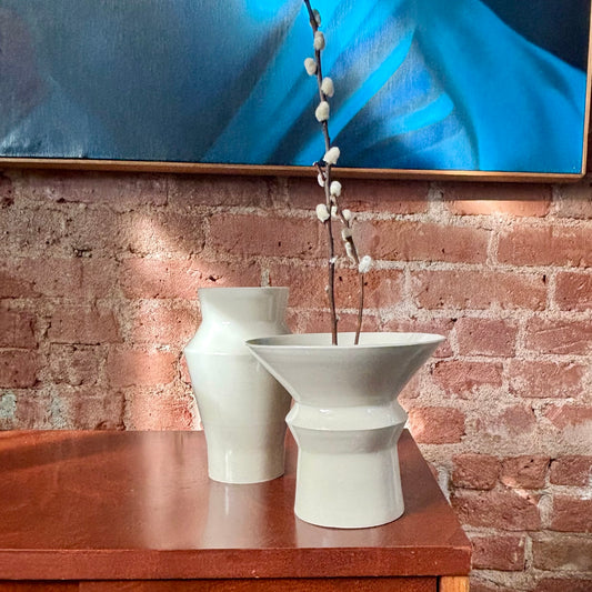 A porcelain angular vase with a wide opening at the top. Perfect for ikebana or as is. Made by Hillit Wahlberg