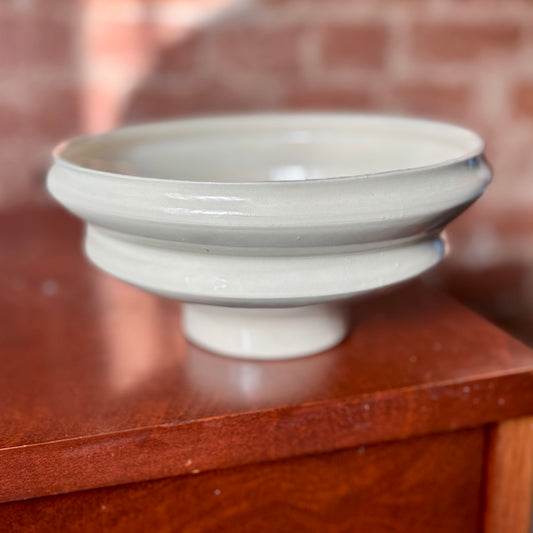 An angular white porcelain decorative bowl. Made by Hillit Wahlberg