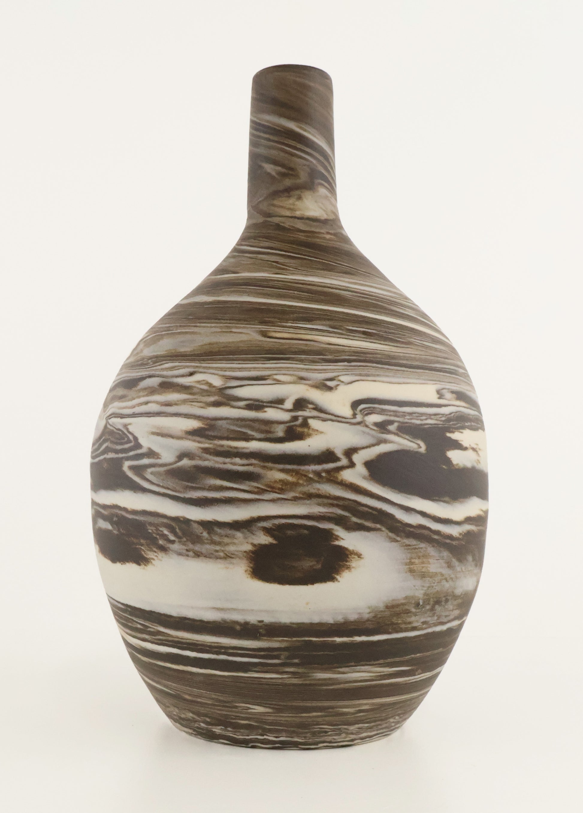 A ceramic vase with a rounded body and a narrow neck, featuring a marbled pattern of brown, beige, and white swirls, photographed against a plain white background.